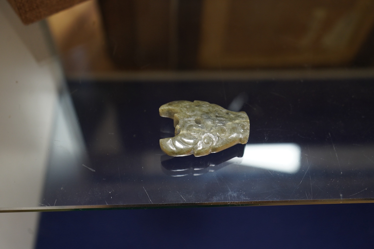 A group of Chinese carved jade and hardstone carvings in archaistic style. Condition - varies